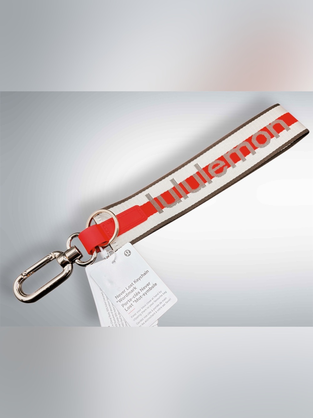 NWT lululemon Never Lost Keychain Wordmark Coconut Ivory/Oxford Red/Walnut